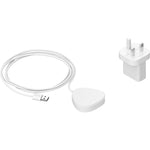 Sonos Roam Wireless Charger White with USB plug white next to it front angled top down view against a white background.