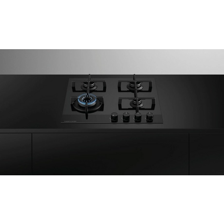 Black gas stove on a black and gray background