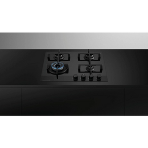 Black gas stove on a black and gray background