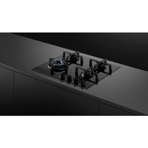Gas stove on a black kitchen countertop with a white background