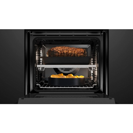 Black oven with food inside on a white background