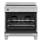 Stainless steel oven with open door on a white background