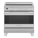 Stainless steel induction range cooker with manual controls on a white background