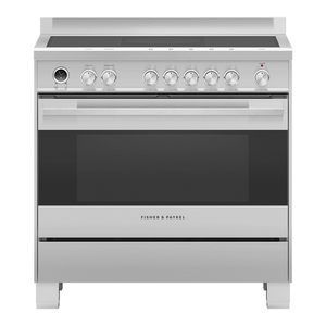 Stainless steel induction range cooker with manual controls on a white background