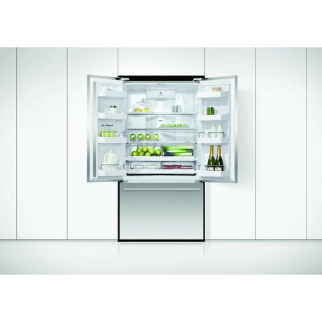 Modern refrigerator with open door displaying various items on a white background