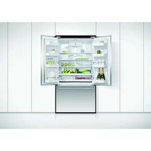 Modern refrigerator with open door displaying various items on a white background