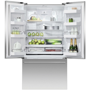 Open refrigerator with various food items inside on a white background