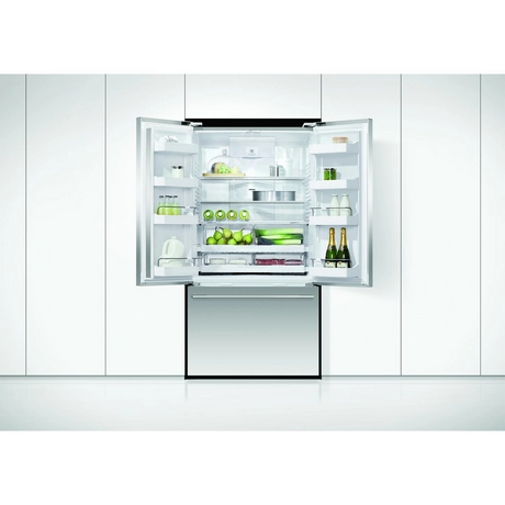 Modern refrigerator with open door displaying various items on a white background