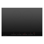 Black induction cooktop with four heating zones on a white background