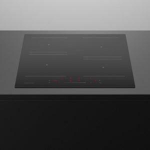 Black induction cooktop on a grey countertop