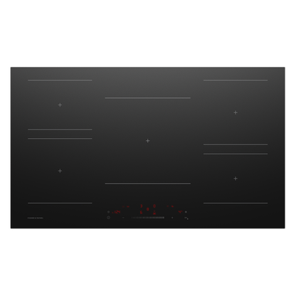 Black induction cooktop with digital display on a white background